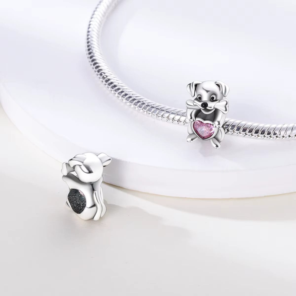 Dog Holding Pink Heart Charm