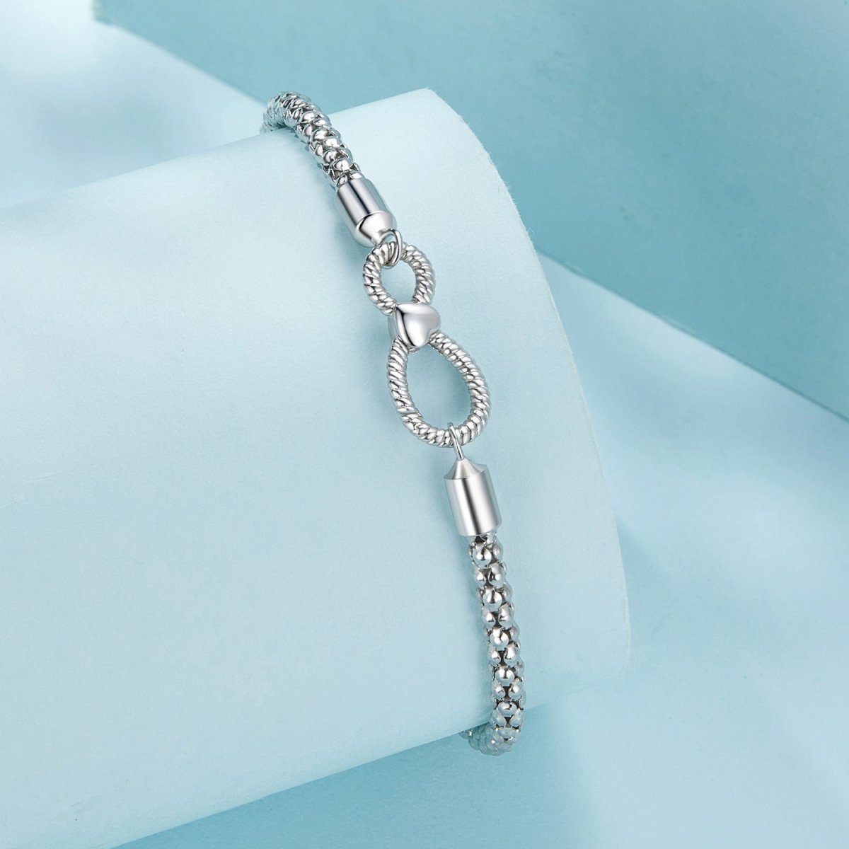 Infinity Clasp Woven Charm Bracelet