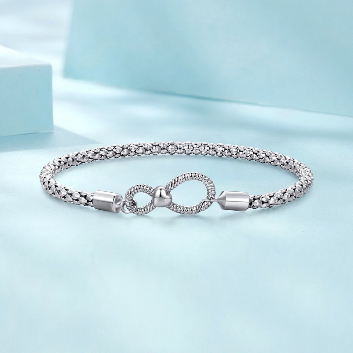Infinity Clasp Woven Charm Bracelet